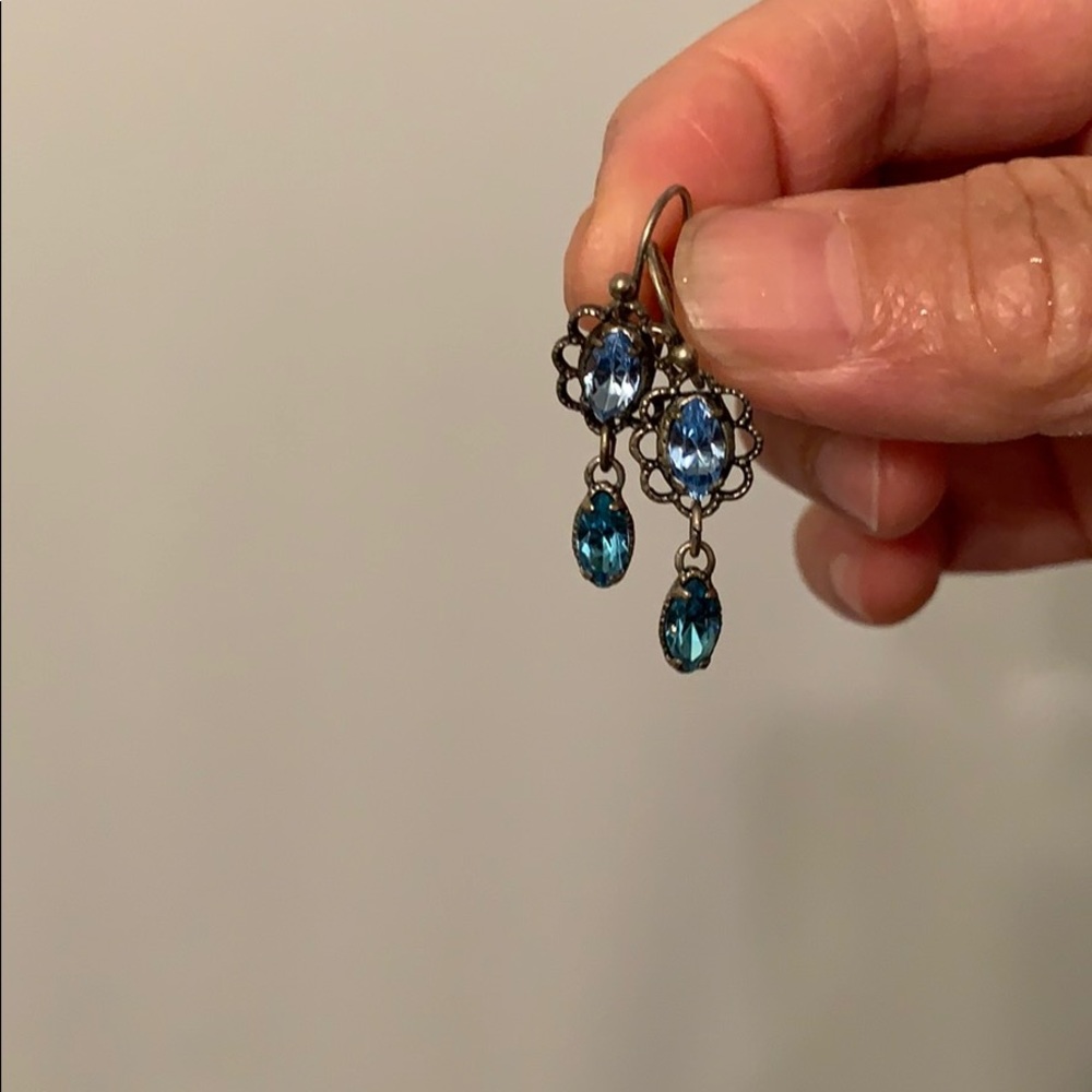 Silver tone blue crystal dangling earrings